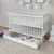 Babybett mit Schublade Kinderbett Gitterbett 60×120 höhenverstellbar & herausnehmbare Sprossen optional mit Matratze | Weiss sehr stabil Made in…